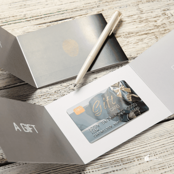 Gift Cards on Light Wooden Background