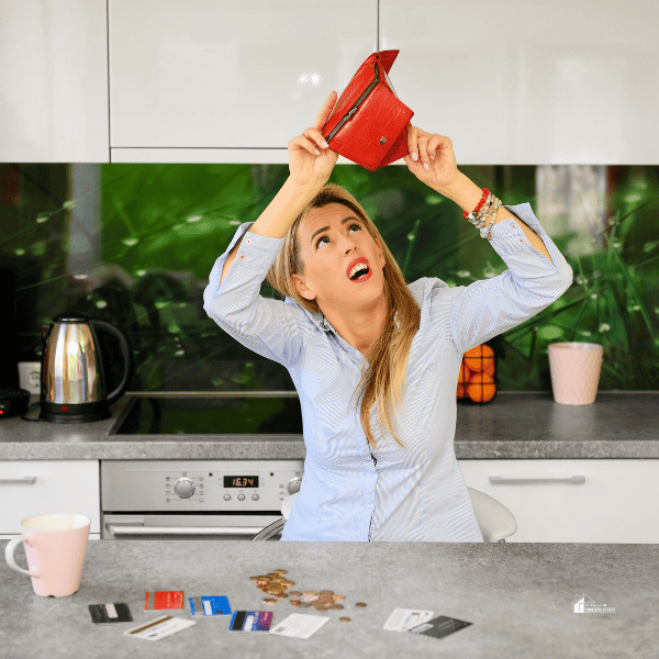 Woman Searching for Money in Her Empty Wallet