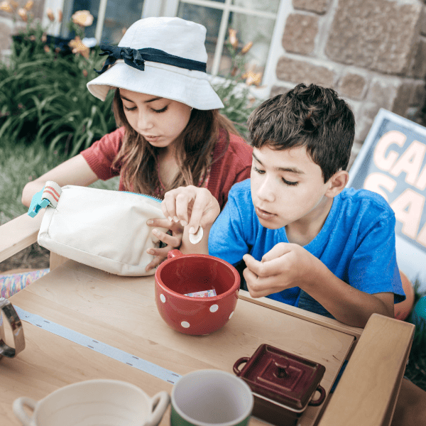 Kids helping with garage sale.