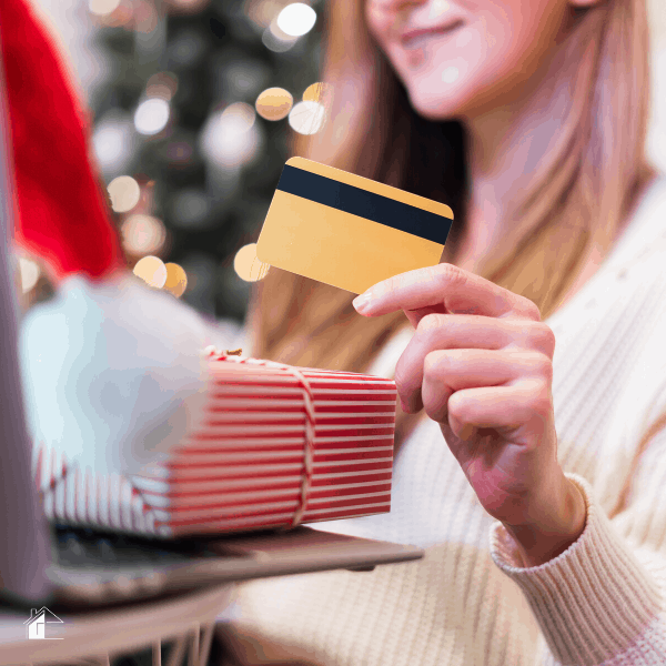 Photo of woman holing a credit card