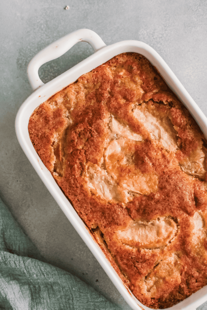 Top view of all in one apple cake in baking pan.