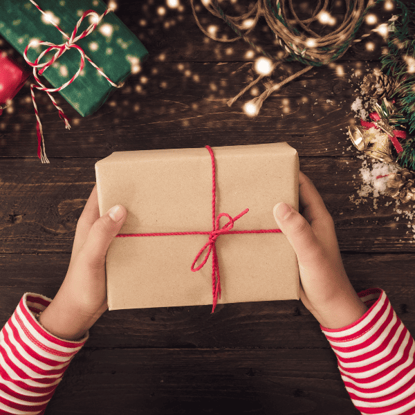 Woman holding a wrapped Christmas gift