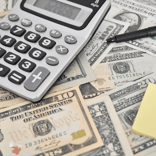 an image of money and calculator in a table