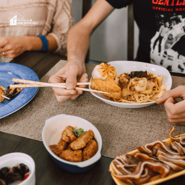 asian people eating on a table