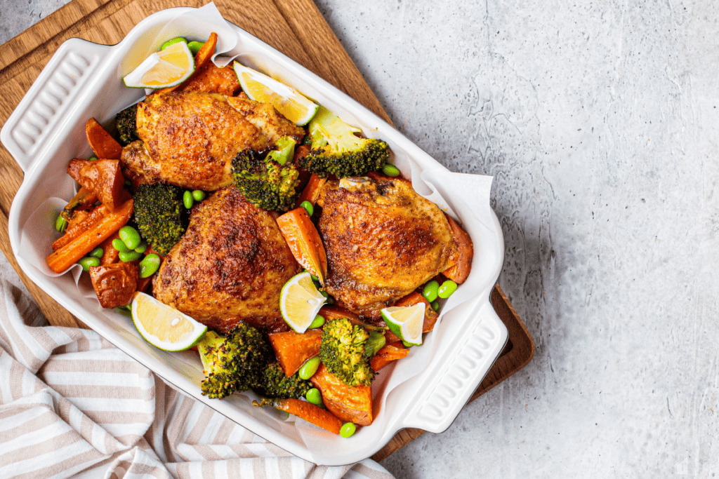 Bakes chicken with vegetables, served.