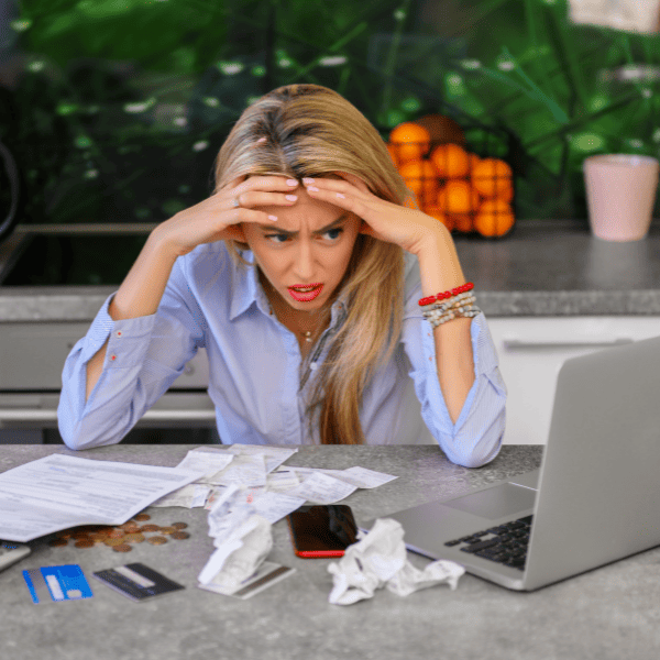 Despereate woman stressing over bills. 