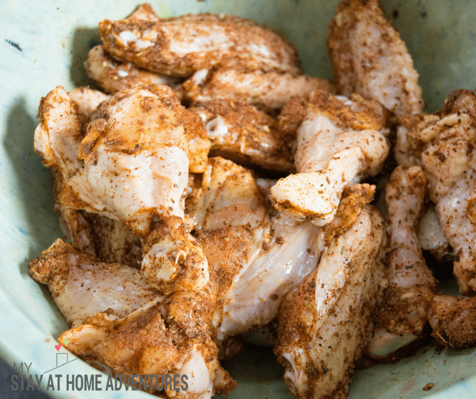 Raw chicken wings seasoned.