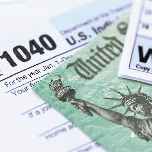 IRS tax forms with tax refund check