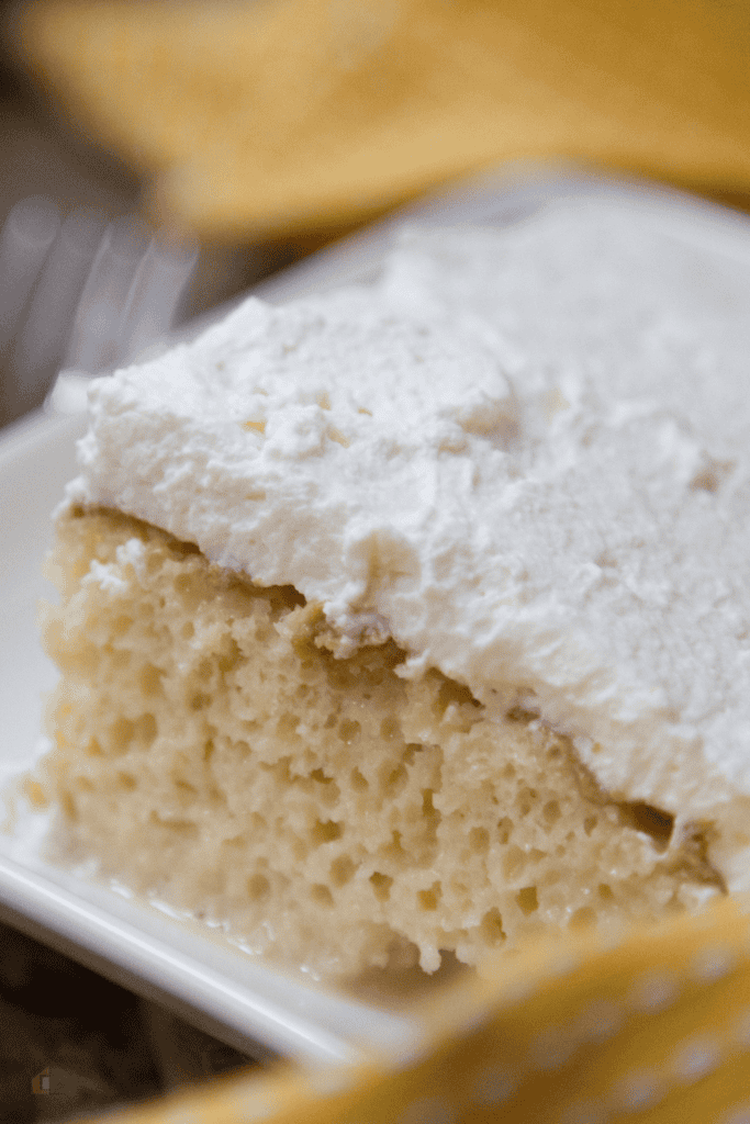 Close up of a slice of tres leche cake
