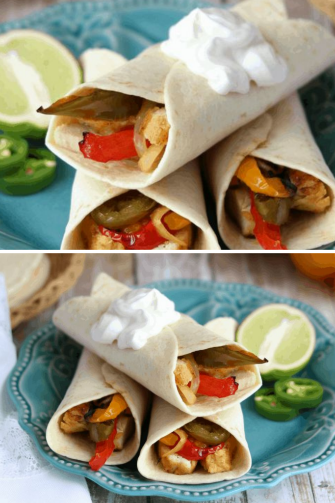 Close-up view of Sous Vide Tequila-Lime Chicken Fajitas filled with chicken, bell peppers, and onions, served with lime and sliced jalapeños.