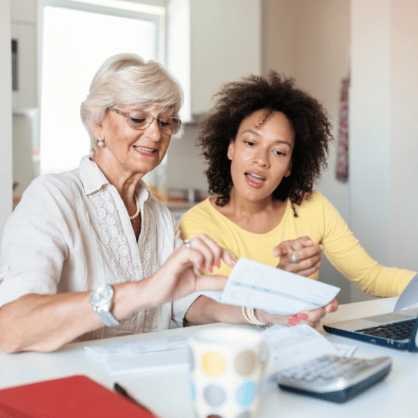 Biracial family paying bills online.