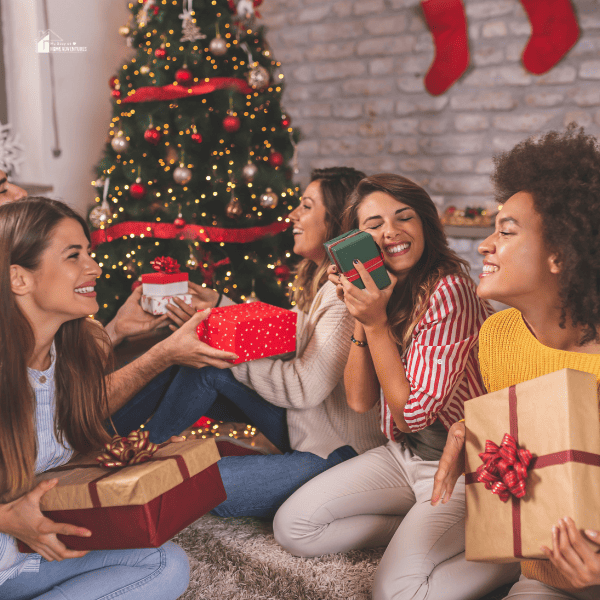 Friends exchanging Christmas gifts