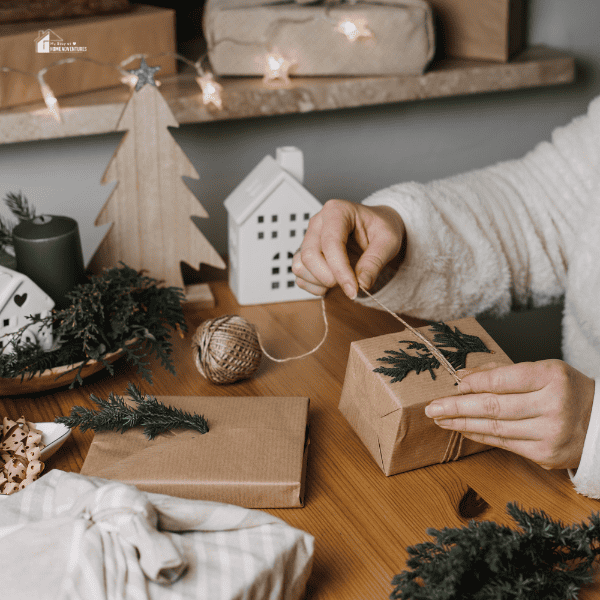 Woman wrapping Christmas DIY gifts in craft paper