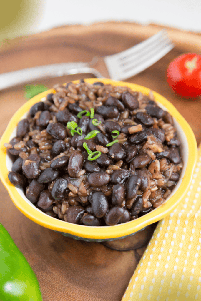 Close up view of served brown rice with black beans.