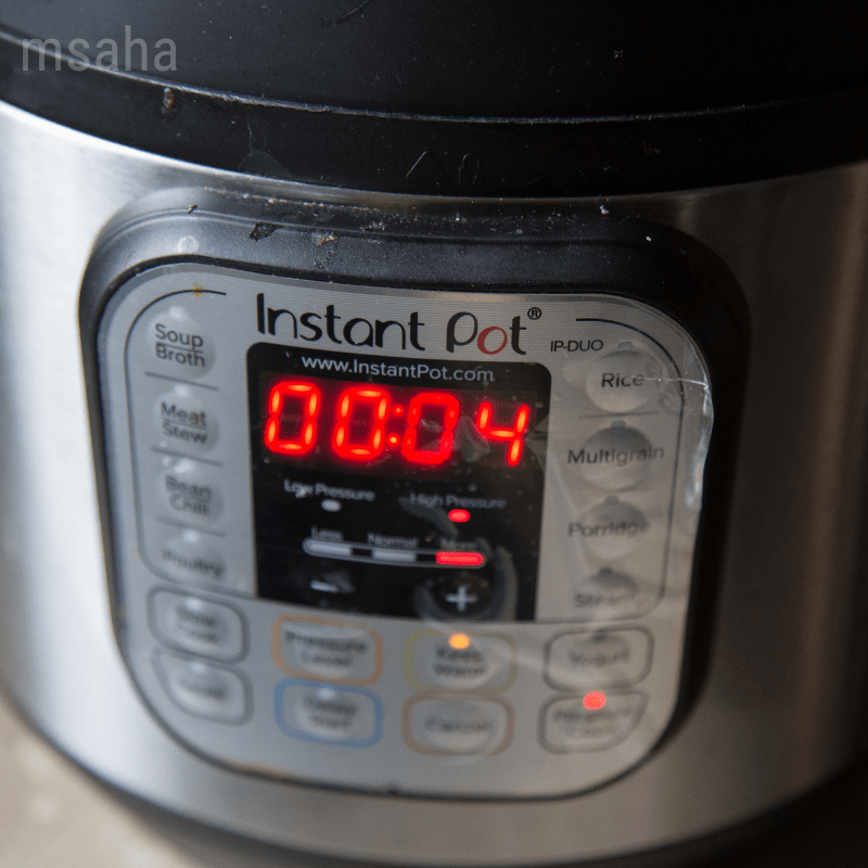 close up photo of instant pot displaying 4 minutes