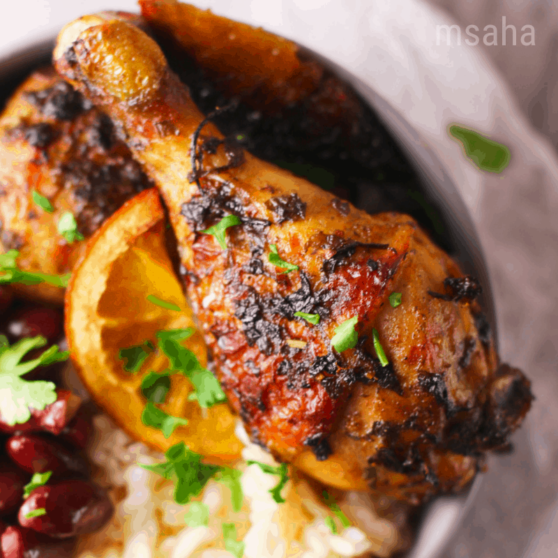 photo of cuban mojo chicken served with rice and beans