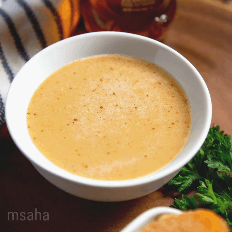 Honey mustard in a small white bowl