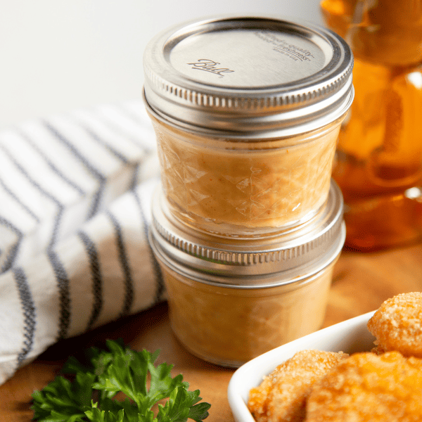 honey mustard sauce in little mason jars
