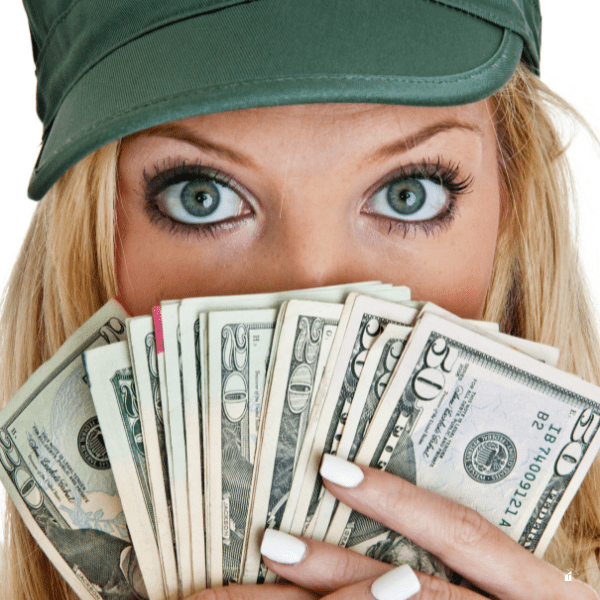 women holding cash in front of her face.