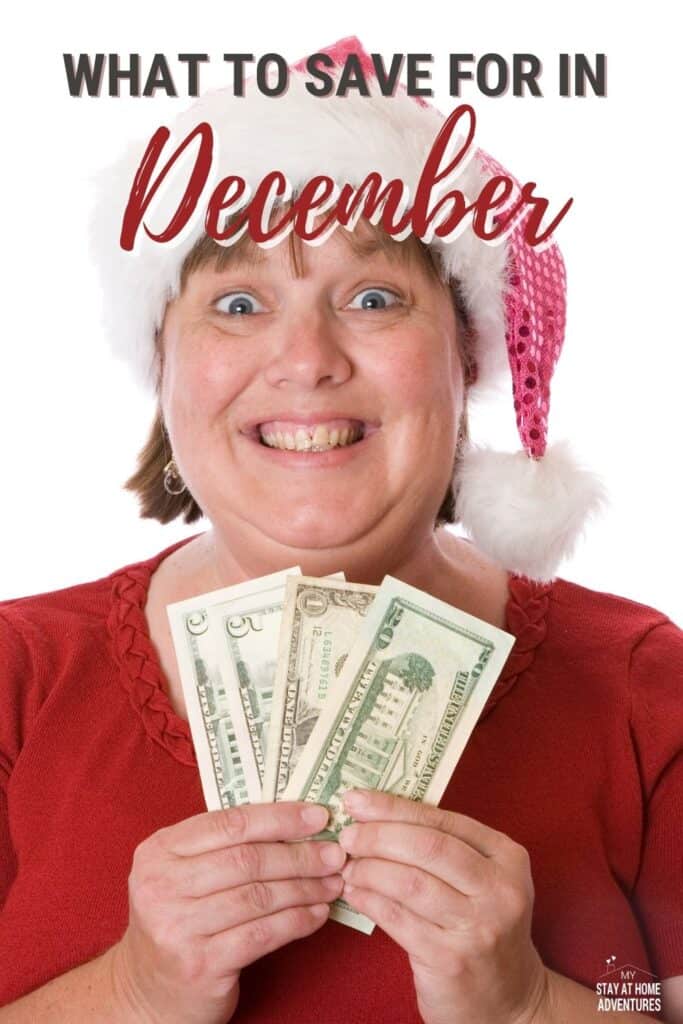 Woman wearing a santa's hat and holding cash.