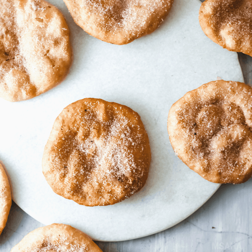 Photo of Mexican Buñuelos laying flat on counter.