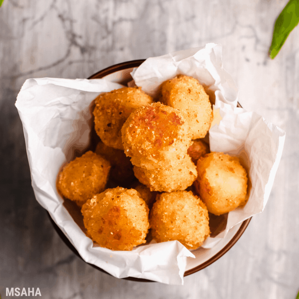 bunch of bolitas de quesos in a bowl