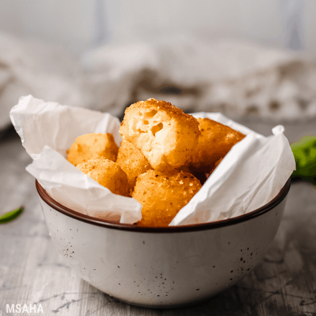 bunch of bolitas de quesos in a bowl