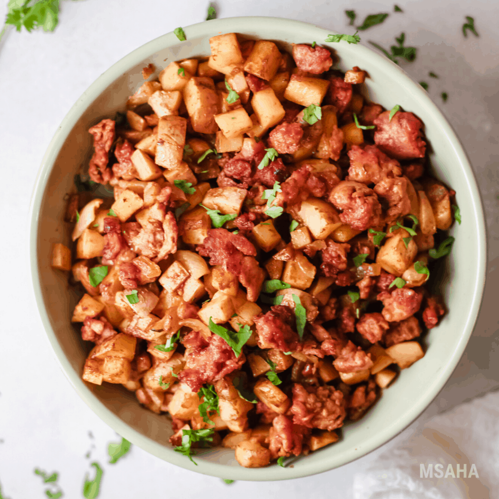 close up photo of chorizo con papas plated.