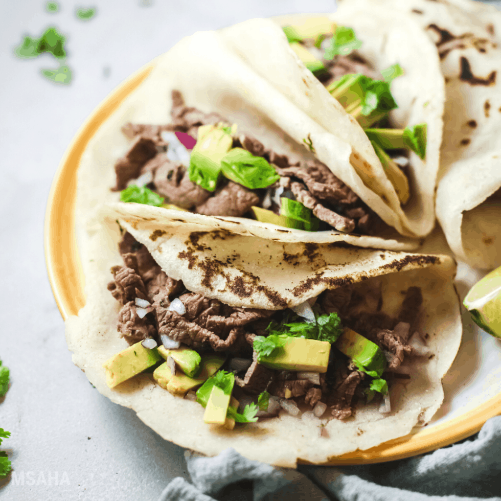 steak tacos plated