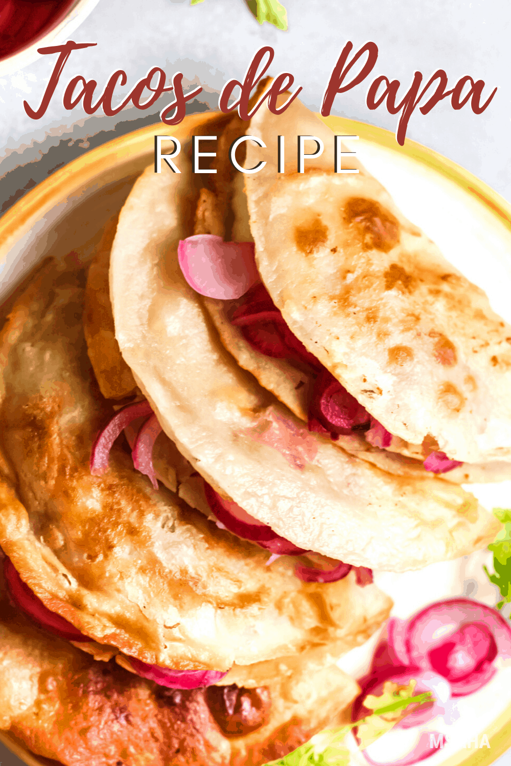 Tacos de papa are fried tacos filled with seasoned mashed potatoes, pickled red onions, cotija cheese. You can top with tomatoes, sour cream, and more. via @mystayathome