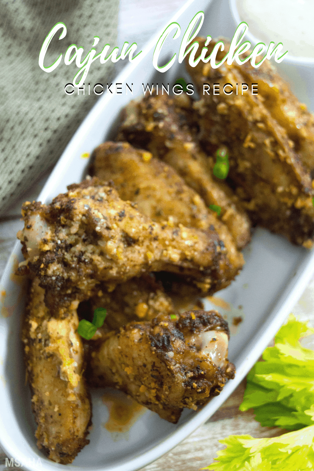 Learn how to make these crispy delicious, and spicy Cajun Chicken Wings. Baked to perfections and coated with a delicious sauce. #chickenrecipe #chickenwings #bakedchickenwings via @mystayathome