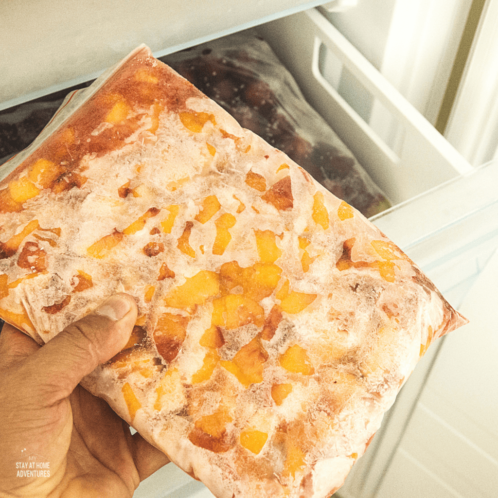 Gallon freeze bag full of frozen fruit.