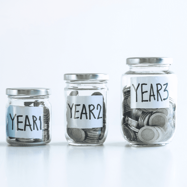 Three jars filled with coins.