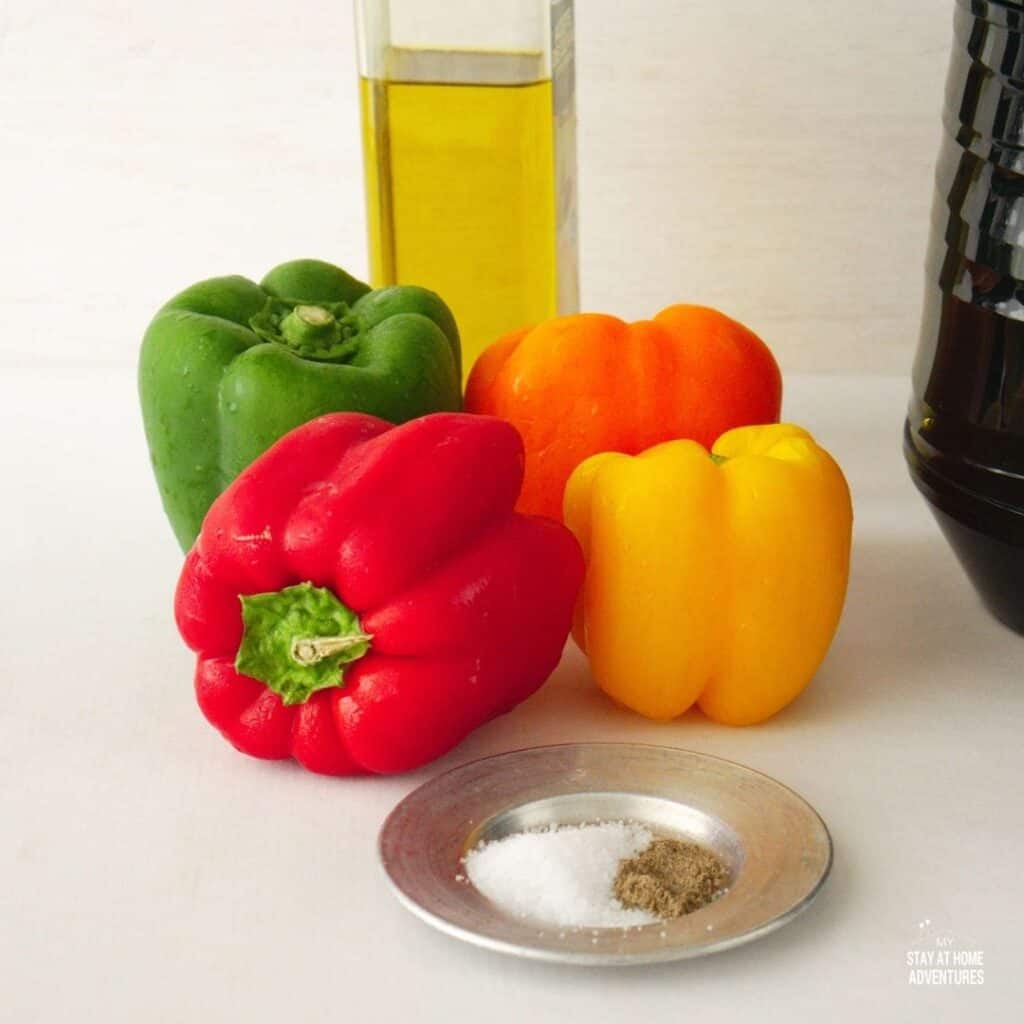 ingredients to make roasted peppers in the air fryer, olive oil peppers and other seasoning powders.