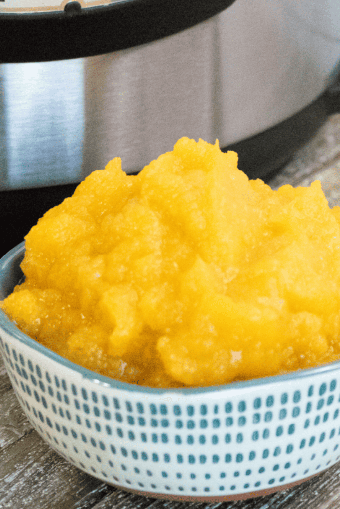 Closeup of pumpkin puree in the background an instant pot