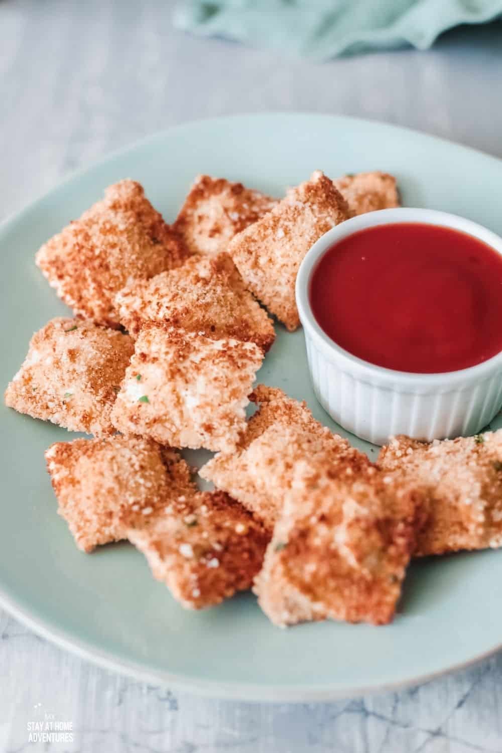 Air Fried Ravioli are easy to make and made with fresh ravioli, eggs, breadcrumbs, parmesan cheese, paprika, salt, and pepper. via @mystayathome