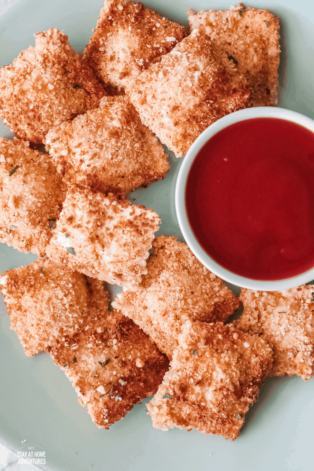 Air Fried Ravioli are easy to make and made with fresh ravioli, eggs, breadcrumbs, parmesan cheese, paprika, salt, and pepper. via @mystayathome