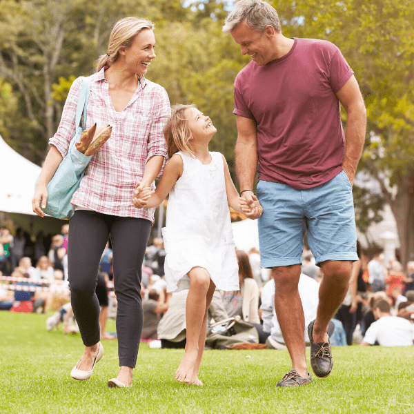 Family Relaxing at Outdoor Summer Event.