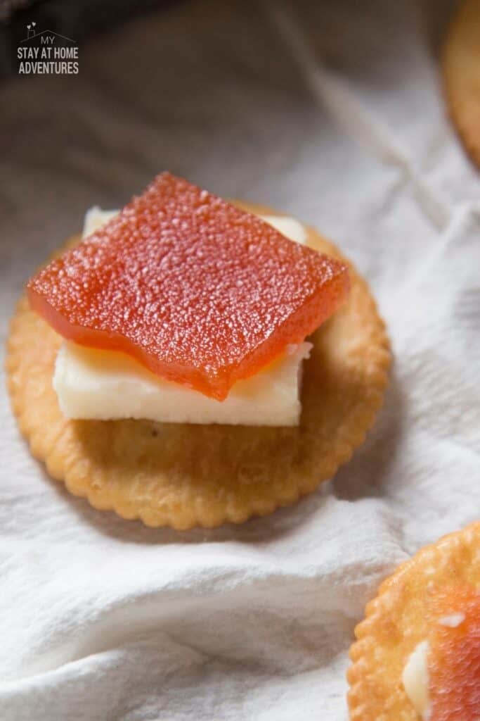 ritz cracker with cheese and guava paste on top