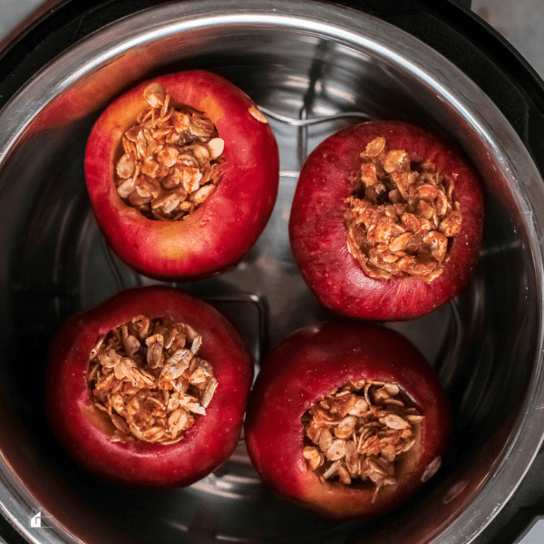 four stuffed apples inside an instant pot