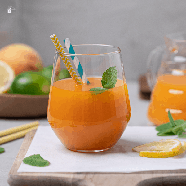 juice in a glass with two straws