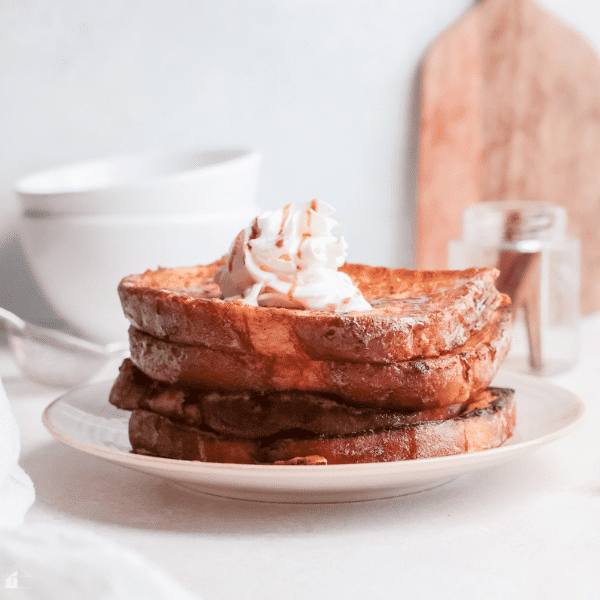 eggnog french toast topped with whip cream