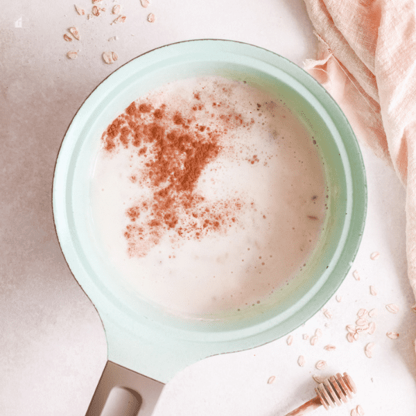 milk, cinnamon in a pot