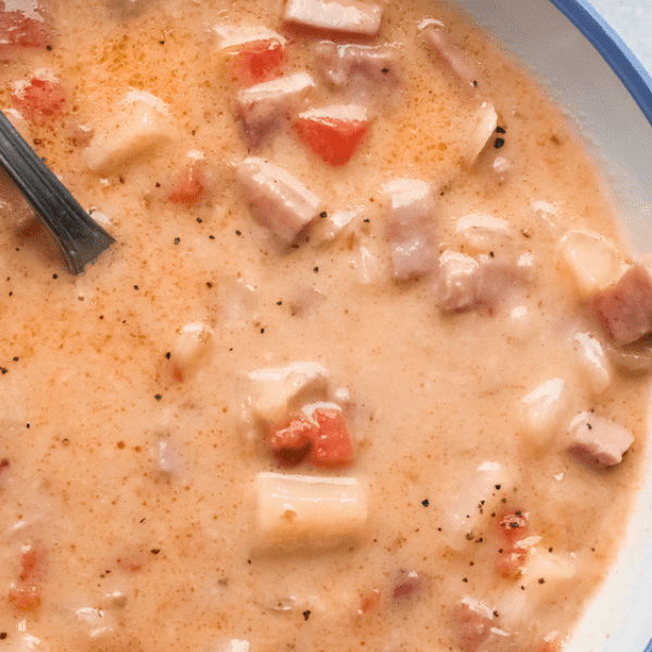 Close up of ham potato soup in a bowl.