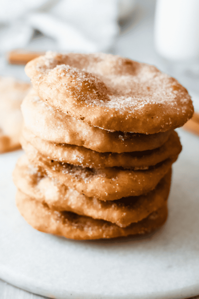 close of 6 Mexican Buñuelos stacked on top of each other.