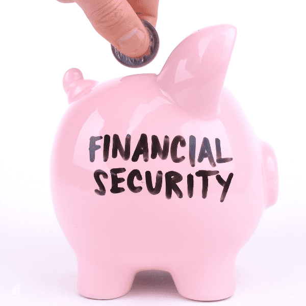 Dropping coins into a pink piggy bank with financial security written on it.