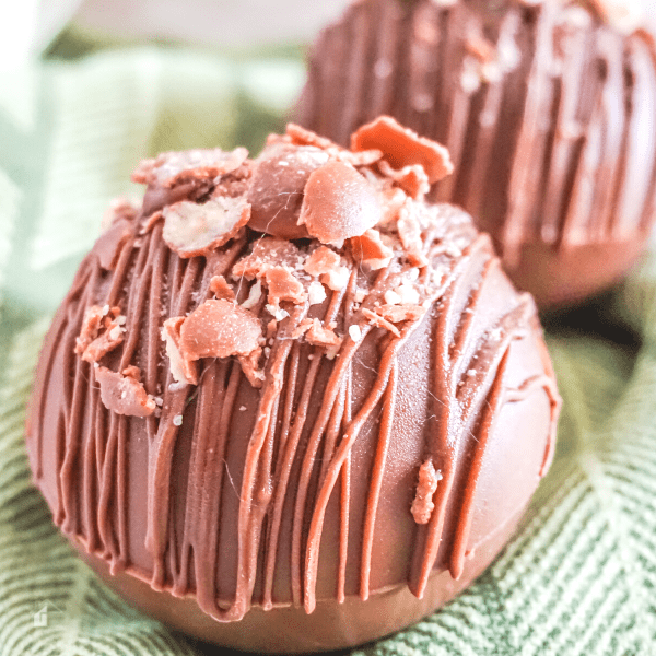 close up of two Whoppers Hot Cocoa Bombs 