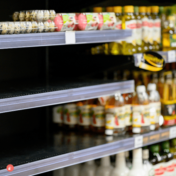 Empty egg shelves in a grocery store or supermarket.