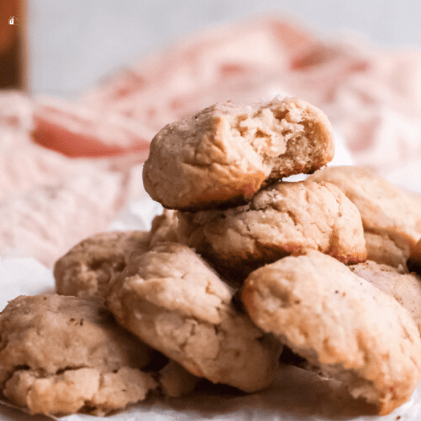 Mexican polvorones stacked with the top cookie bitten 