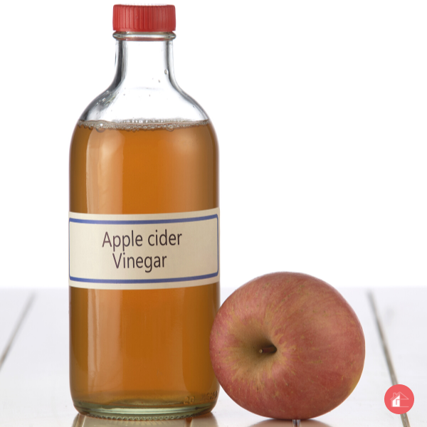 apple cider vinegar on white table top